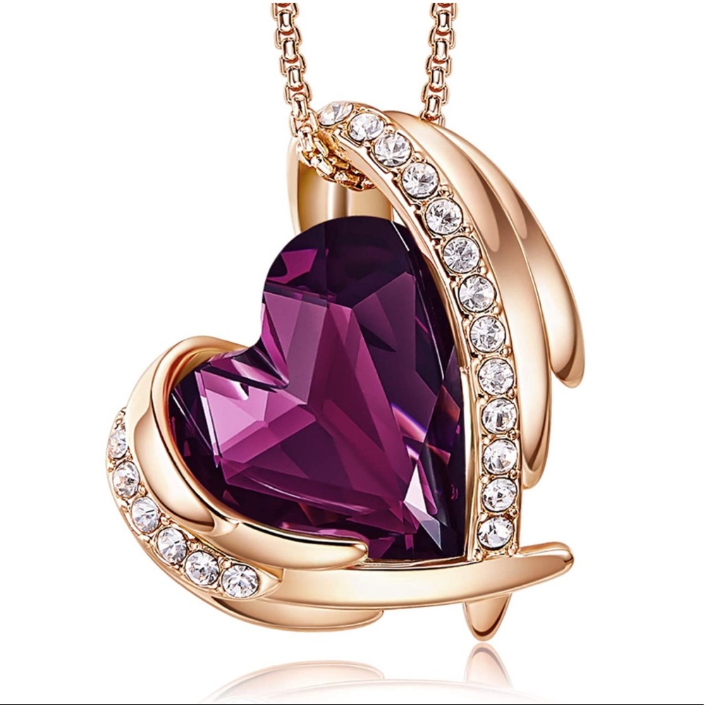 Gold and Purple Heart necklace. Brand new never worn !
